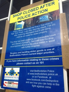 police sign on shop window