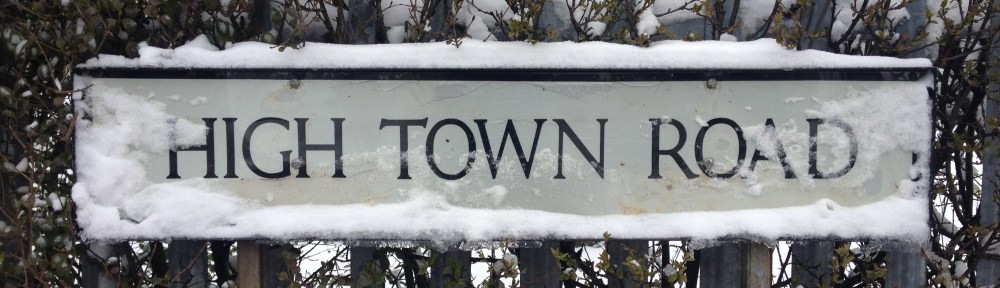 High Town Road sign, covered by snow.