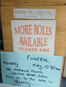 (Name and details of the funeral have been obscured.)