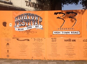 High Town (or 'Hightown') Festival sign in front of the now sadly fire-ravaged premises of the former pub, the Railway Tavern. 