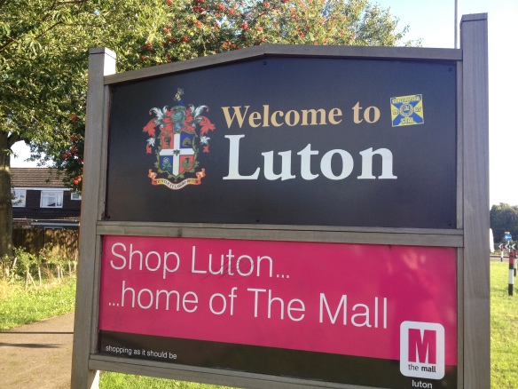 Welcome to Luton sign with Mall advertisement